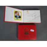 Two Nottingham Forest brand autograph books containing a quantity of football related autographs