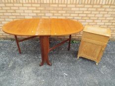 Lot to include a drop leaf table, approximately 75 cm x 25 (159) cm x 91 cm and a bedside cabinet,