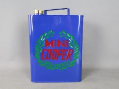 A blue Mini Cooper petrol can, approx 35