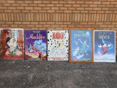 Five framed Disney animated film posters