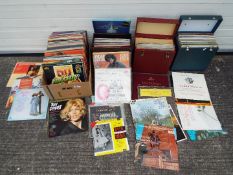 A collection of 12" vinyl records, mainl