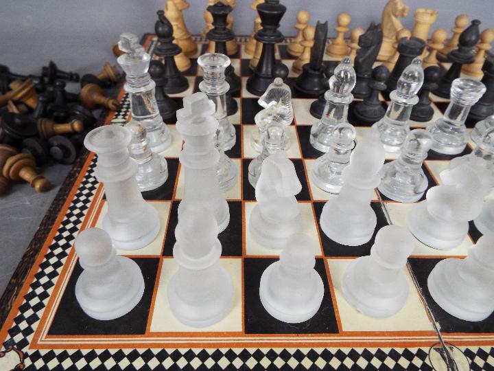 Three chess sets to include a glass set with 7.5 cm king and two wooden set, the larger with 8. - Image 2 of 4