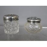 Two silver topped dressing table jars, one of Chester assay 1918, the other Birmingham assay 1922,