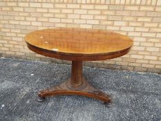 A circular top table measuring approximately 73 cm x 106 cm.