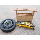 Lot to include an hydraulic trolley jack, space saver tyre and a small wooden workbench.