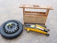 Lot to include an hydraulic trolley jack, space saver tyre and a small wooden workbench.