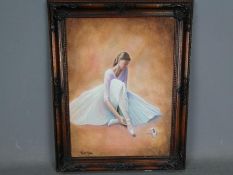 Tom Riley - A framed oil on canvas depicting a ballet dancer putting on shoes, signed,