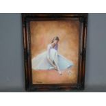 Tom Riley - A framed oil on canvas depicting a ballet dancer putting on shoes, signed,