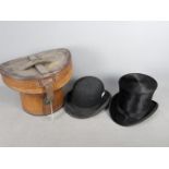 A leather top hat box containing a T Crick, Bury top hat,