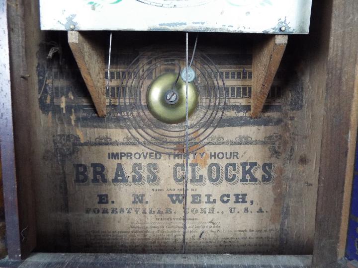 An American 30 hour wall clock by E N Welch, Roman numerals to a white dial. - Image 3 of 6