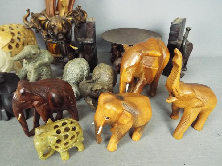 A herd of elephant figurines, carvings and similar. - Image 3 of 4