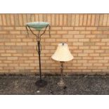 A decorative table lamp, 85 cm (h) and a glass bowl on wrought iron stand, 115 cm (h).