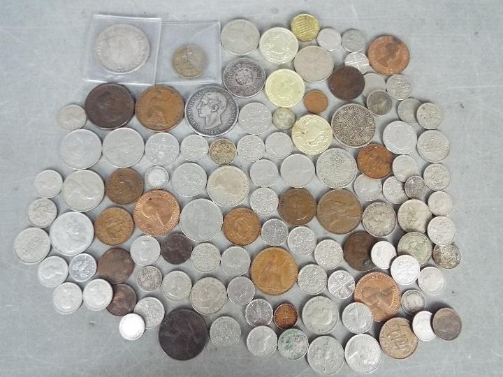 A small collection of coins with some silver content examples to include 1875 Five Pesetas,