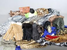 A quantity of scarves, gloves, belts and similar.