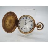 A gold plated, full hunter pocket watch with 15 jewel Lanco movement and Dennison case.