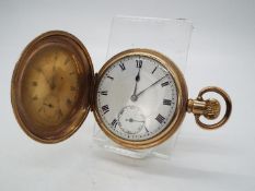 A gold plated, full hunter pocket watch with 15 jewel Lanco movement and Dennison case.