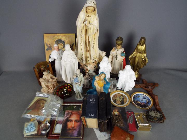 A collection of religious themed items to include plaster models, ceramic, brass and similar.