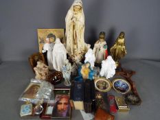 A collection of religious themed items to include plaster models, ceramic, brass and similar.
