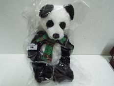 Charlie Bears - Panda with a tartan bow. Jointed. Factory sealed with tag inside. 33cm high.