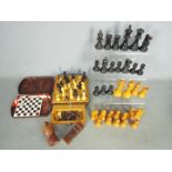 Two loose chess sets, the larger with 9 cm king and two travelling sets.