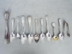 A collection of hallmarked silver cutlery, various assay and date marks,