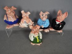 A set of five Wade Natwest pigs money banks.