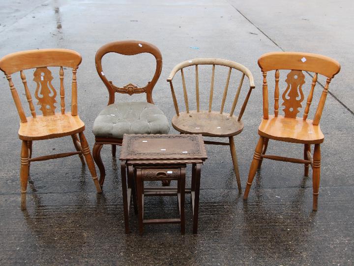 Four chairs and a nest of three tables.