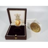 A 1999 ¼ Ounce Britannia gold proof coin (approximately 8.