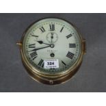 A mid-20th century ships clock, brass case with opening cast brass bezel,