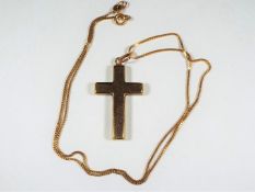 A 9ct gold chain with cross pendant stamped 'C9', approximately 3.6 grams all in.