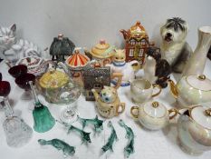 A collection of tea pots to include Sadler and similar,