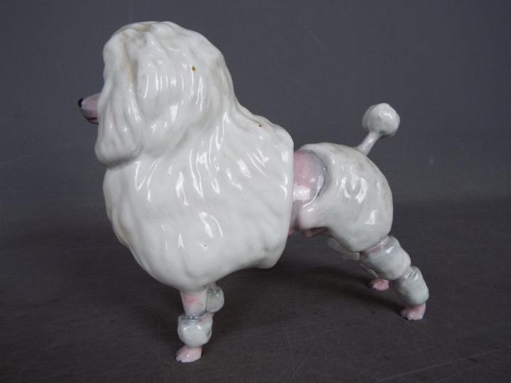 A Royal Doulton figurine depicting a lion cut poodle, approximately 13 cm (h). - Image 2 of 5