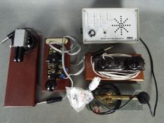 Four morse keys, one a bakelite Lancaster example and a practice oscillator.