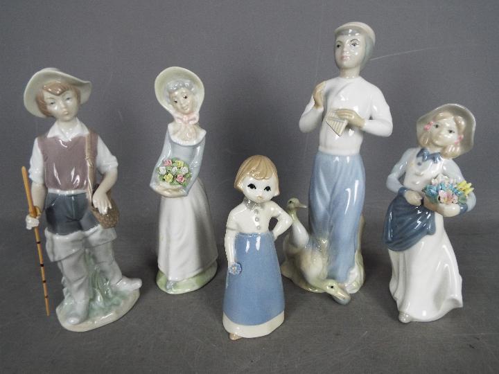 Five Spanish figurines to include Lladro, Nao and similar, largest approximately 26 cm (h).