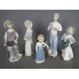 Five Spanish figurines to include Lladro, Nao and similar, largest approximately 26 cm (h).