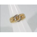 A 9ct gold ring set with six small diamonds, size O, approximately 3.6 grams all in.
