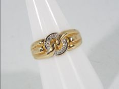 A 9ct gold ring set with six small diamonds, size O, approximately 3.6 grams all in.