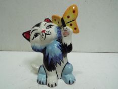 Lorna Bailey "Cat + Butterfly" - Stylistic cat with a butterfly in its raised paw. Multicoloured.