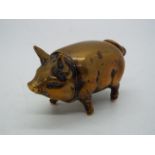 A late 19th or early 20th century novelty vesta case / match safe in the form of a pig, 5 cm (l).