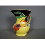 Susie Cooper - A jug with hand painted decoration against a yellow ground, approximately 18.