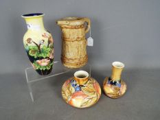 Three Old Tupton Ware vases with floral tubelined decoration,