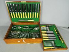 An oak cased canteen of silver plated cutlery by Mappin & Webb for twelve settings.