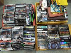 A large quantity of DVD's, feature films, box sets, four boxes.