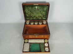 A late 19th / early 20th century travelling toilet case with fitted interior,