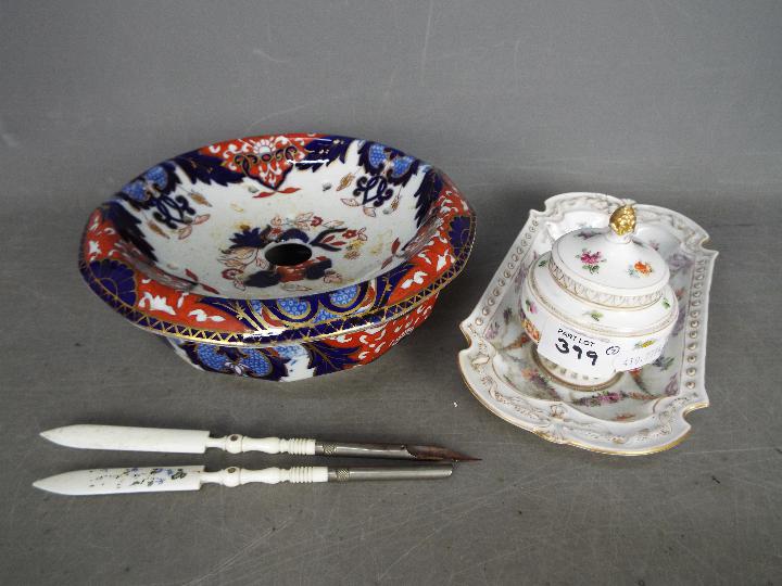 A continental desk tidy with single inkwell and cover having floral decoration and a Masons