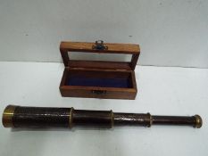 Dollond London - Telescope in fitted glass front wooden box. Floral decoration. Impressed marks.