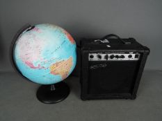 A Spur practice amplifier and an illuminating terrestrial globe, approximately 40 cm (h).
