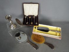 A small collection of hallmarked silver items to include silver backed dressing table mirror and