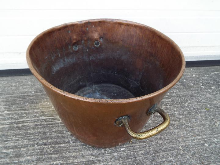 A large copper and brass preserving pan with twin handles, approximately 33 cm (h) x 47 cm (d). - Image 3 of 4