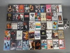 A collection of vintage music cassettes to include U2, INXS, Deacon Blue, Erasure,